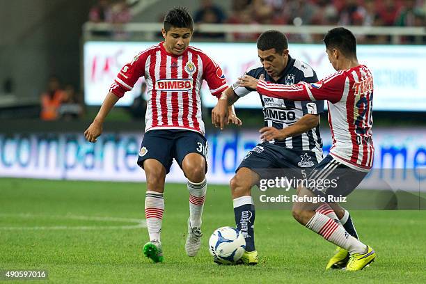 Efrain Juarez of Monterrey fights for the ball with Marco Fabian of Chivas during the 11th round match between Chivas and Monterrey as part of the...