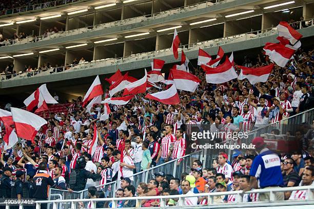 Fans of Chivas cheer for their team during the 11th round match between Chivas and Monterrey as part of the Apertura 2015 Liga MX at Omnilife Stadium...