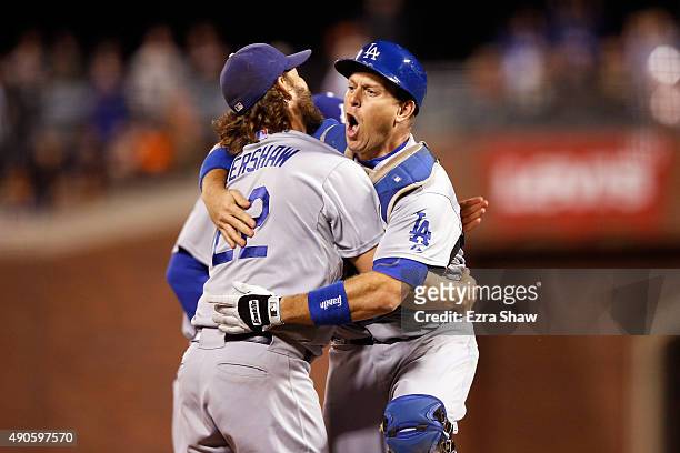 Clayton Kershaw and A.J. Ellis of the Los Angeles Dodgersn celebrate after they beat the San Francisco Giants to clinch the National League West...