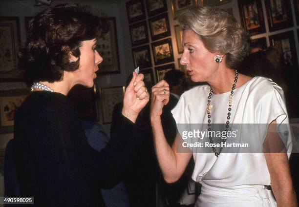 Carolyn Roehm and Marella Agnelli attend a preview at Christie's, New York, New York, 1988.