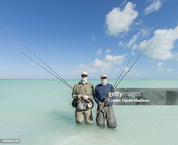 two men with bonefishing gear, christmas island. - île christmas photos et images de collection