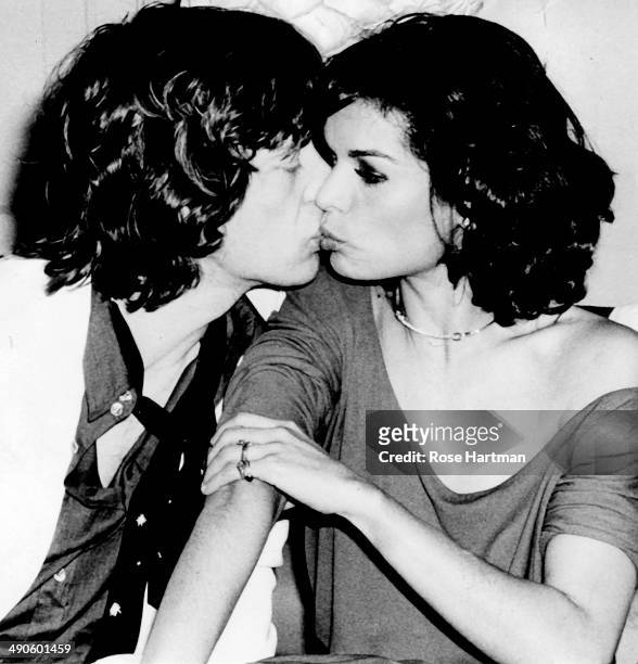 Mick Jagger gives Bianca a kiss during Bianca's birthday party at Studio 54, New York, New York, 1977.