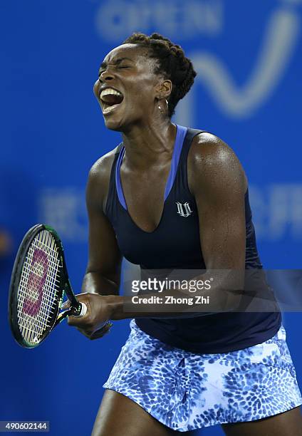 Venus Williams of USA reacts during the match against Carla Suarez Navarro of Spain on Day 4 of 2015 Dongfeng Motor Wuhan Open at Optics Valley...