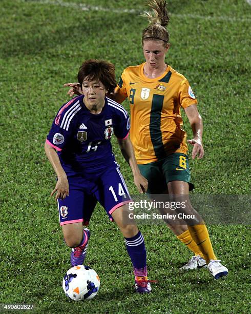 Nanase Kiryu of Japan is checked by Caitlin Foord of Asutralia during the AFC Women's Asian Cup Group A match between Australia and Japan at Thong...