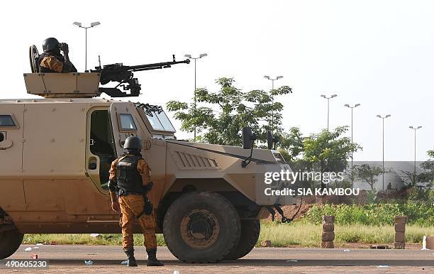 An armored vehicle is deployed during a sweep operation in an area near the military barracks of the elite presidential guard in Ouagadougou, on...