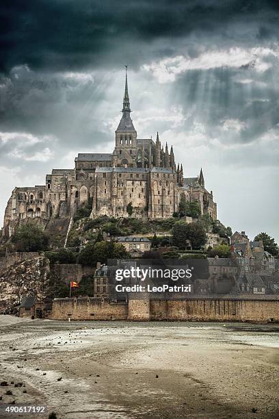 le mont saint michel in normandy france - medieval castle stock pictures, royalty-free photos & images