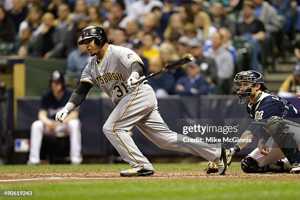 Jose Tabata of the Pittsburgh Pirates hits a RBI single scoring Pedro Alvarez in the top of the fourth inning against the Milwaukee Brewers at Miller...