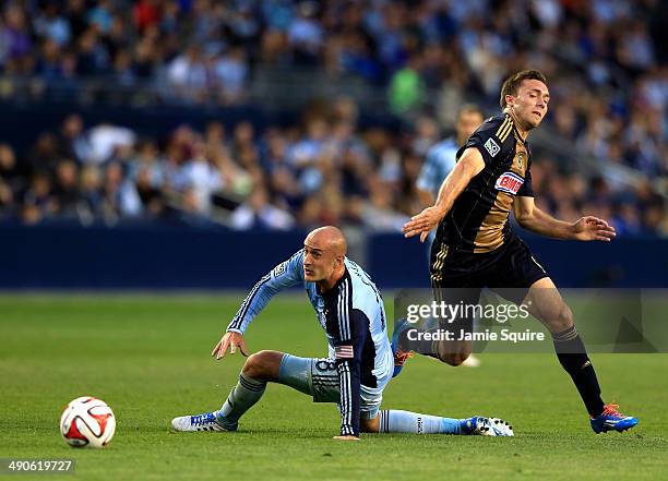 Aurelien Collin of Sporting KC and Andrew Wenger of Philadelphia Union battle for the ball during the game at Sporting Park on May 14, 2014 in Kansas...