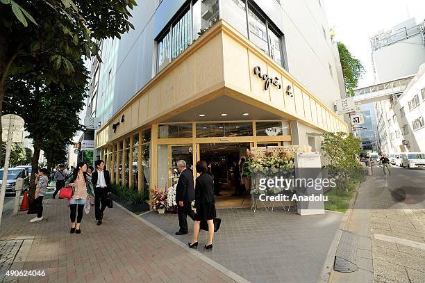 Shoppers are seen walking past the new Agnes b. Store at the high-end shopping district of Ginza in Tokyo, Japan, on September 30, 2015. Agnes b....