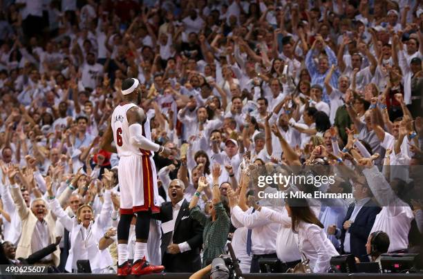 LeBron James of the Miami Heat recats to winning Game Five of the Eastern Conference Semifinals of the 2014 NBA Playoffs against the Brooklyn Nets at...