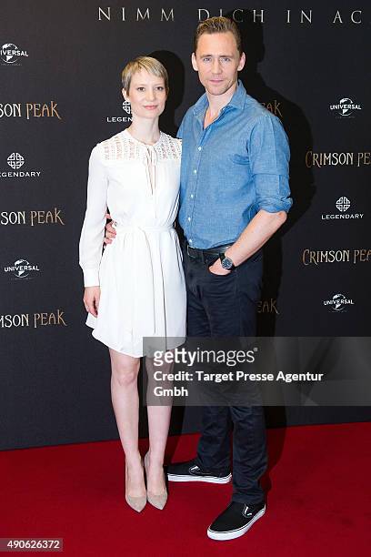 Tom Hiddleston and Mia Wasikowska attend the 'Crimson Peak' photocall at The Regent Hotel on September 30, 2015 in Berlin, Germany.