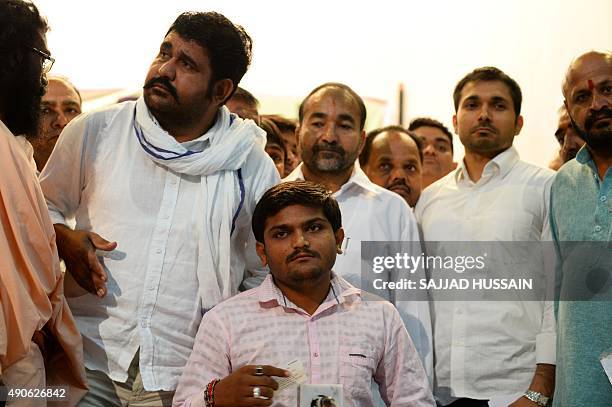 Indian convenor of the 'Patidar Anamat Andolan Samiti' movement Hardik Patel looks on ahead of the start of a press conference in New Delhi on...