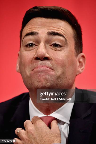 British Shadow Home Secretary Andy Burnham waits on stage to speak to delegates during the final day of the Labour Party Autumn Conference on...