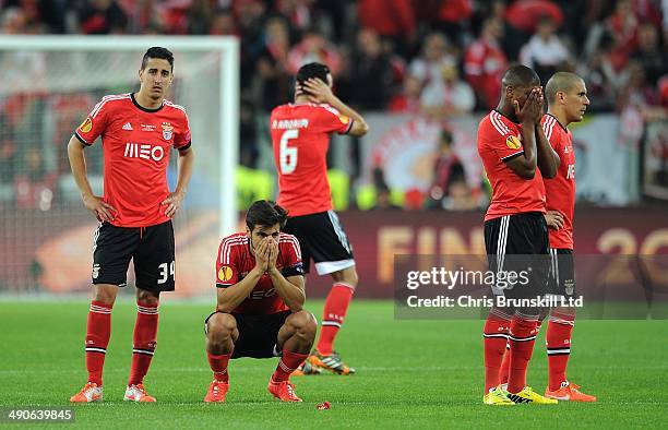 Benfica players react as they watch the penalty shoot-out during the UEFA Europa League Final match between Sevilla FC and SL Benfica at Juventus...