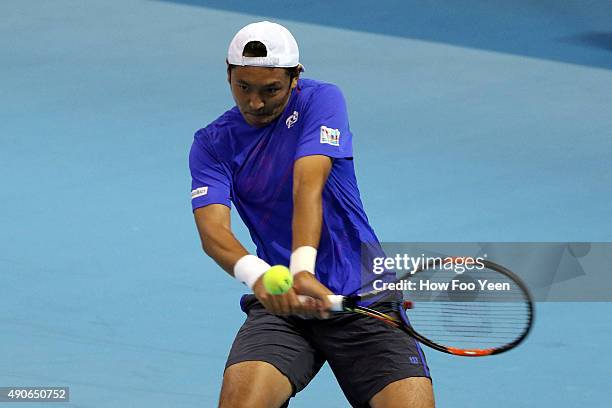 Tatsuma Ito of Japan competes against Nick Kyrgios of Australia during the 2015 ATP Malaysian Open at Bukit Jalil National Stadium on September 30,...