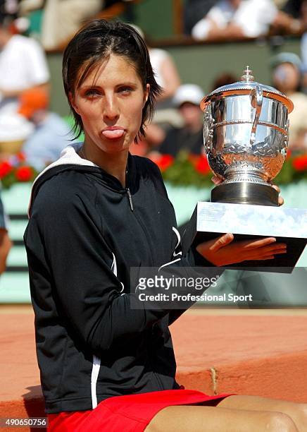 Anastasia Myskina of Russia making fun with the trophy after winning her womens final match against Elena Dementieva of Russia during Day Thirteen of...