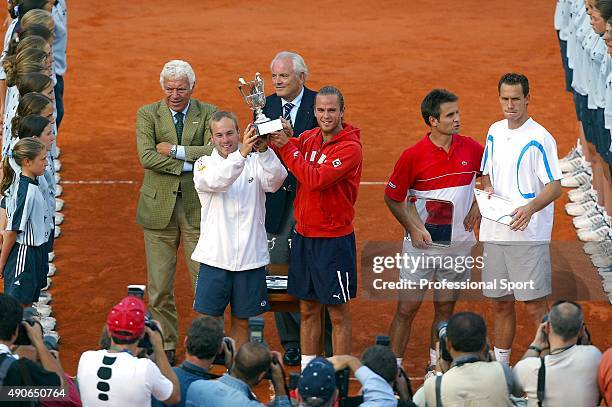 Xavier Malisse and Olivier Rochus of Belgium celebrate with the trophy after winning their mens doubles final match against Michael Llodra and...