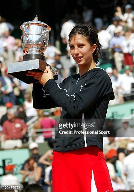 Anastasia Myskina of Russia celebrates with the trophy after winning her womens final match against Elena Dementieva of Russia during Day Thirteen of...