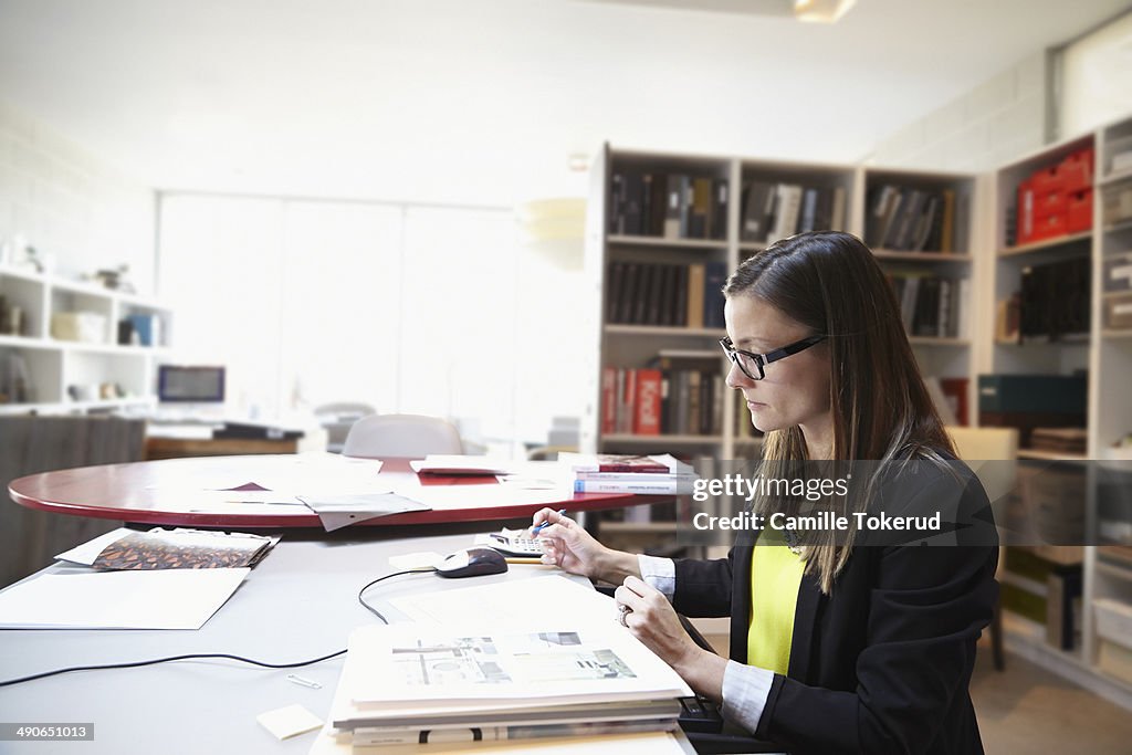 Side view of woman working