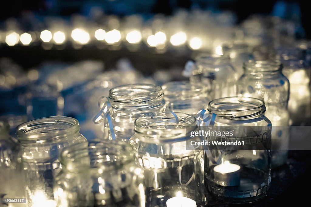Lots of tea lights in jars