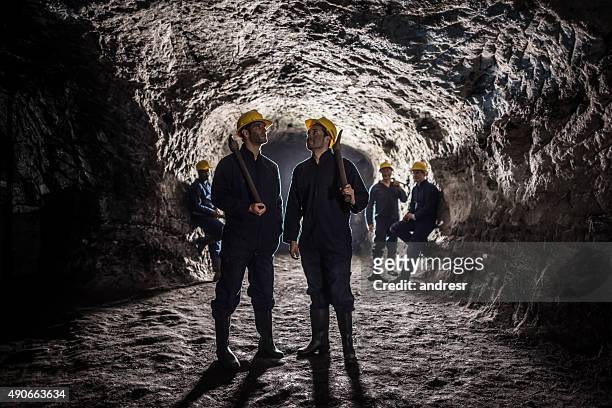 group of miners working at the mine - miner pick stock pictures, royalty-free photos & images
