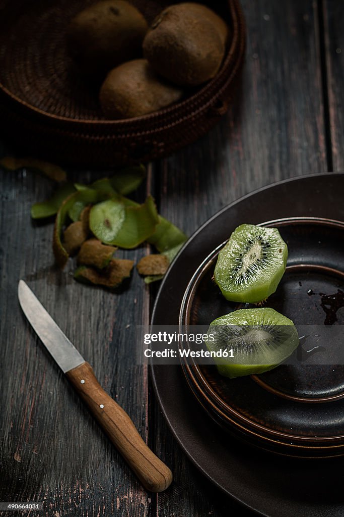 Peeled and sliced kiwi fruit on plate