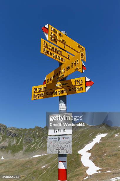 austria, vorarlberg, sign post at st antonier joch - montafon valley stock pictures, royalty-free photos & images