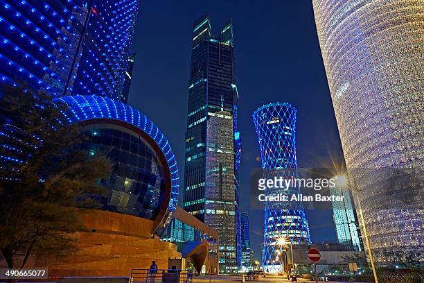 modern architecture in doha at night - doha people stock pictures, royalty-free photos & images