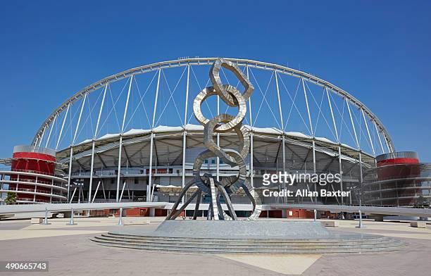 olympic rings sculpture in front of stadium - coupe du monde de football photos et images de collection