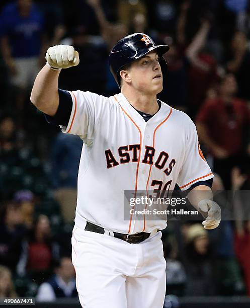 Matt Dominguez of the Houston Astros drives in the winning run with an RBI single in the ninth inning of their game against the Texas Rangers at...