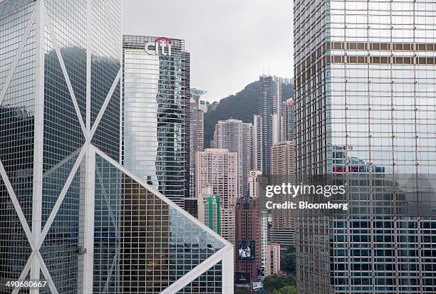 The Bank of China Tower, left, Citibank Tower, second left, and Cheung Kong Center, right, stand in the Central district of Hong Kong, China, on...