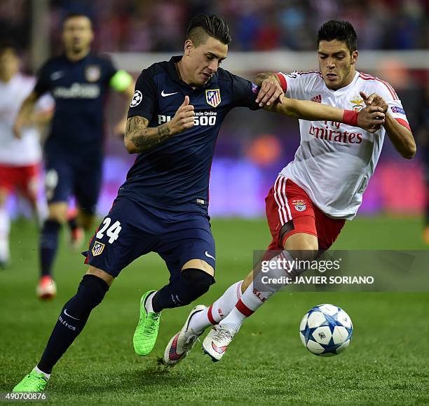 Atletico Madrid's Uruguayan defender Jose Maria Gimenez vies with Benfica's Mexican forward Raul Jimenez during the UEFA Champions League football...