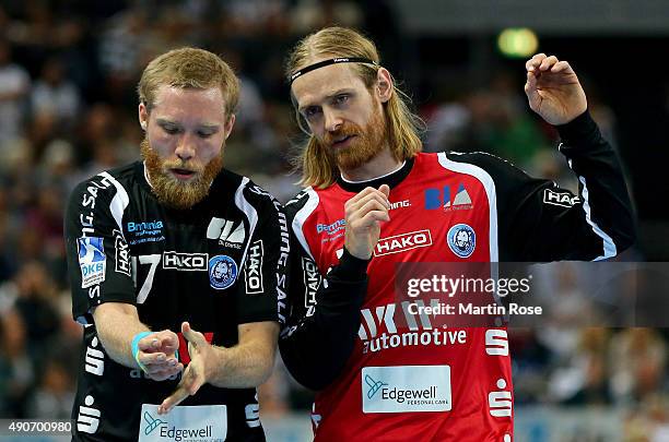 Bjoergvin Gustavsson, goaltender of Bergischer HC gives instructions to team mate Jan Artmann during the DKB HBL Bundesliga match between THW Kiel...