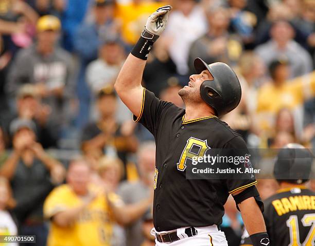 Francisco Cervelli of the Pittsburgh Pirates reacts after hitting a grand slam in the fourth inning during game one of the doubleheader against the...