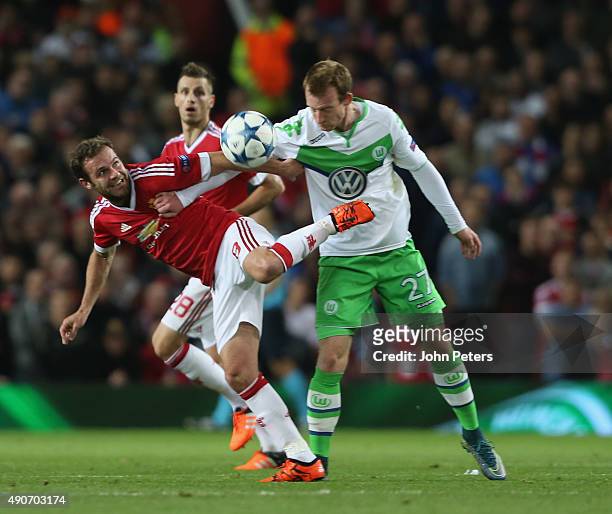 BJuan Mata of Manchester United in action with Maximilian Arnold during the UEFA Champions League Group C match between Manchester United and...