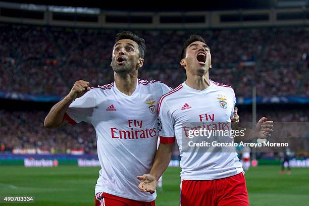 Nicolas Gaitan of SL Benfica celebrates scoring their opening goal with teammate Jonas Goncalves during the UEFA Champions League Group C match...