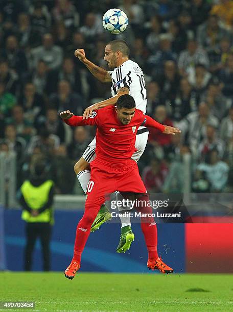 Leonardo Bonucci of Juventus FC competes for the ball with Jose Antonio Reyes of Sevilla FC during the UEFA Champions League group E match between...