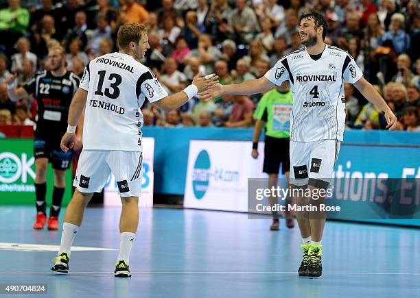 Domagoj Duvnjak of Kiel celebrate with team mate Steffen Weinhold during the DKB HBL Bundesliga match between THW Kiel and Bergischer HC at...