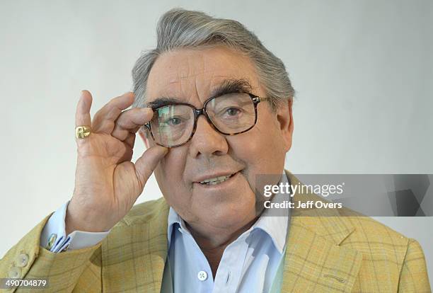 Ronnie Corbett adjusts his glasses, gestures on BBC Breakfast News, 30th April 2007.