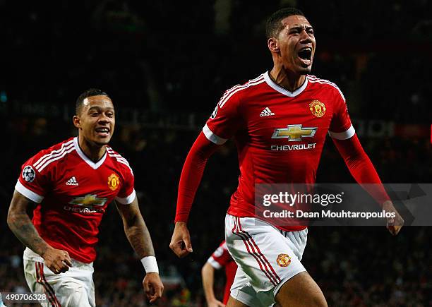 Chris Smalling of Manchester United celebrates with team mate Memphis Depay as he scores their second goal during the UEFA Champions League Group B...