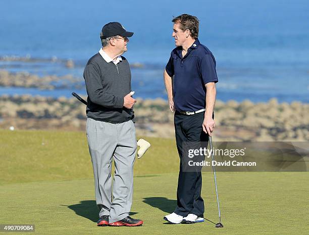 McCoy of Northern Ireland the former National Hunt Champion Jockey talking to J.P.McManus the Irish racehorse owner during final practice for the...