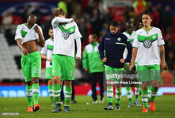Naldo, Nicklas Bendtner, Christian Trasch and Max Kruse of VfL Wolfsburg look dejectd after defeat in the UEFA Champions League Group B match between...
