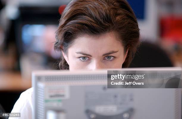 News 24 Presenter JANE HILL in the office shortly before going on air. September 2002