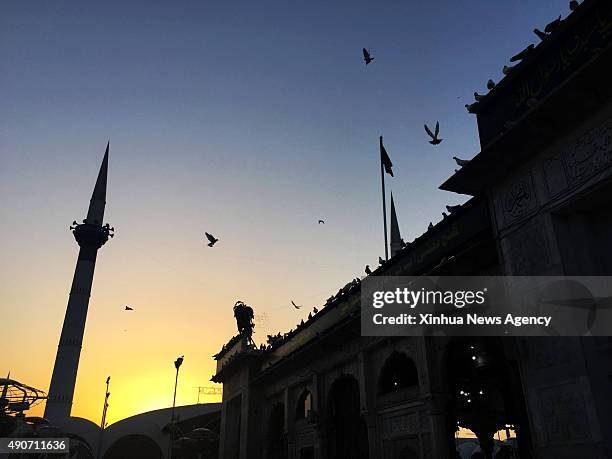 Sept. 30, 2015 -- Photo taken on Sept. 30 shows the view of Data Durbar Shrine during sunset in eastern Pakistan's Lahore on Sept. 30, 2015. Data...