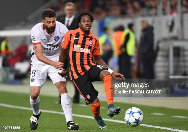 Paris Saint-Germain's Italian midfielder Thiago Motta vies with Shakhtar Donetsk's Brazilian midfielder Fred during the UEFA Champions League group A...