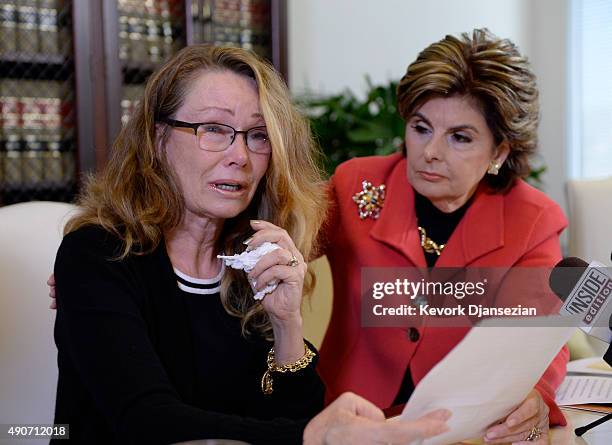 Sharon Van Ert one of three new alleged sexual assault victims of comedian Bill Cosby reacts during a news conference with attorney Gloria Allred...