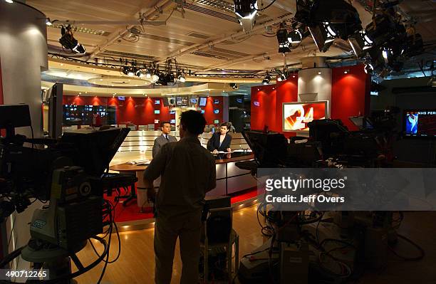 News 24 Presenters MATTHEW AMROLIWALA and JANE HILL on set.