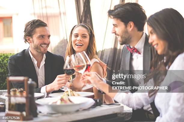 group toast in the restaurant - double date stock pictures, royalty-free photos & images