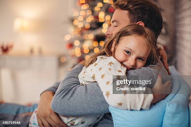 father and his cute daughter in front of christmas three. - happy loving family bildbanksfoton och bilder