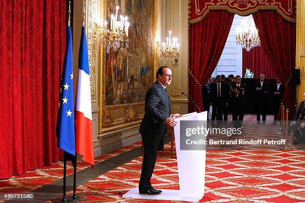 French President Francois Hollande gives to Director of sponsorship LVMH, Jean-Paul Claverie, Insignia of Officer of the Legion of Honor at Elysee...